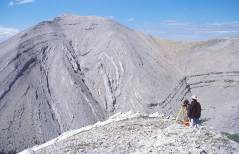 Land surveyor and photogrammetrist gathering control points