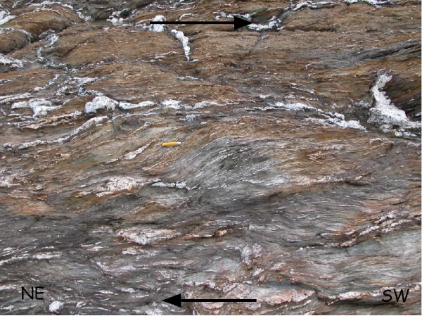 Top-to-the South brittle-ductile shear zones (Stop 1.2).