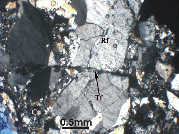 Photomicrograph of breccia with transcrystalline shear fracture