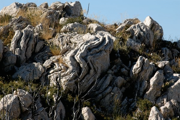 Folded Thick White Limestone Beds behind St. Nicholas Chapel.